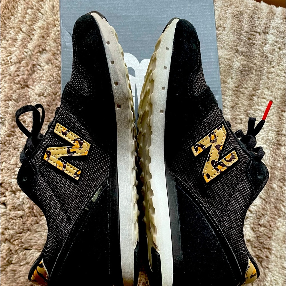 New balance black shoes with leopard print 311v2